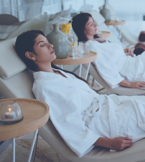 young-women-in-white-robes-relaxing-at-beauty-spa-centre-picture-id913095166