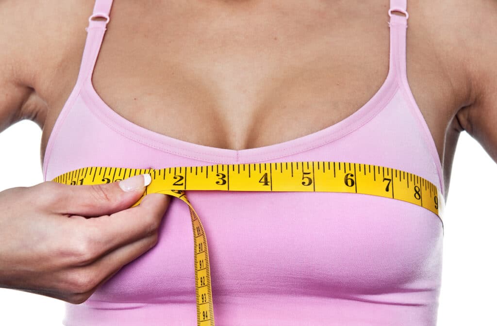 Woman measuring her bust line