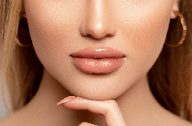 Close up sexy lips in nude lipstick.