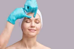 Smiling woman having a consultation with her plastic surgeon about if Botox or a Brow Lift is right for her